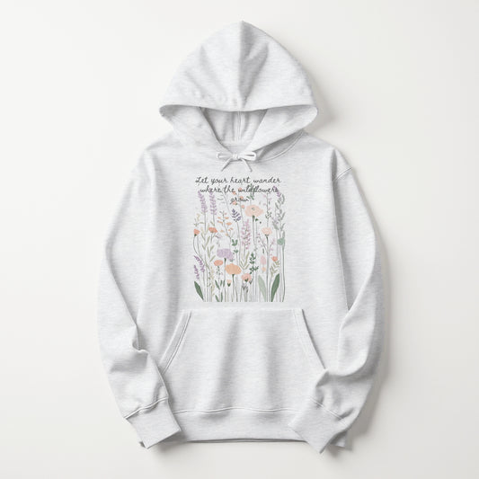 White marle hoodie with botanical illustration and handwritten-style quote about wildflowers.